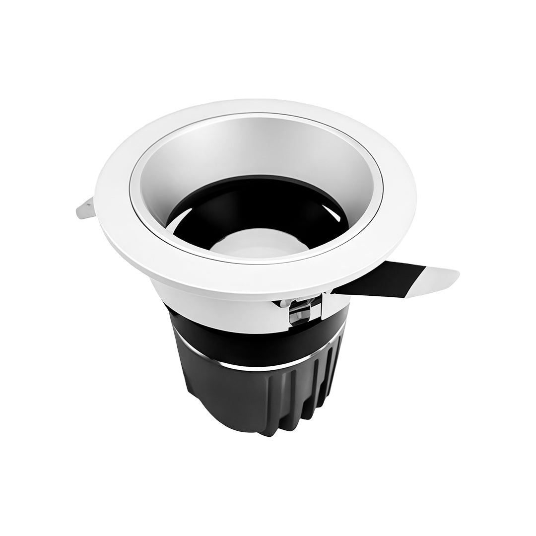 Recessed flush mount spotlights with glass shade chandelier aesthetic featuring white housing and deep-set black reflector cone.