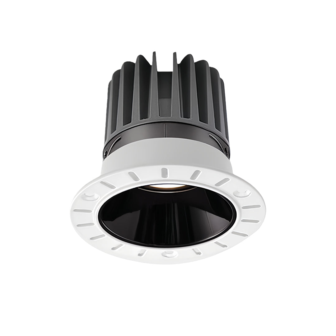 Recessed indoor LED spotlight in white finish with glass shade chandelier influenced deep-set design for ambient lighting.