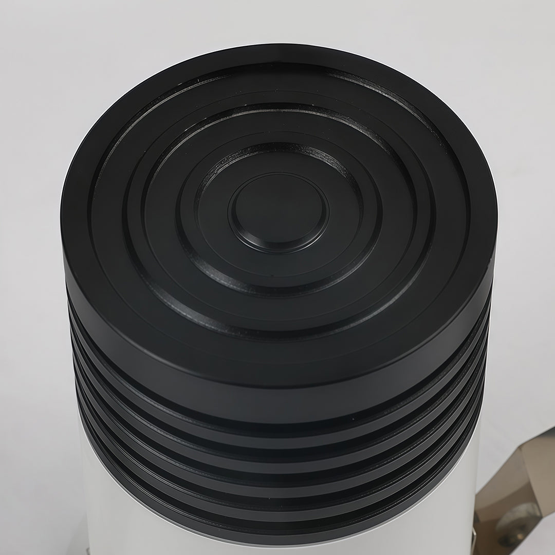 Black heat sink component of recessed LED ceiling light displaying thermal engineering detail