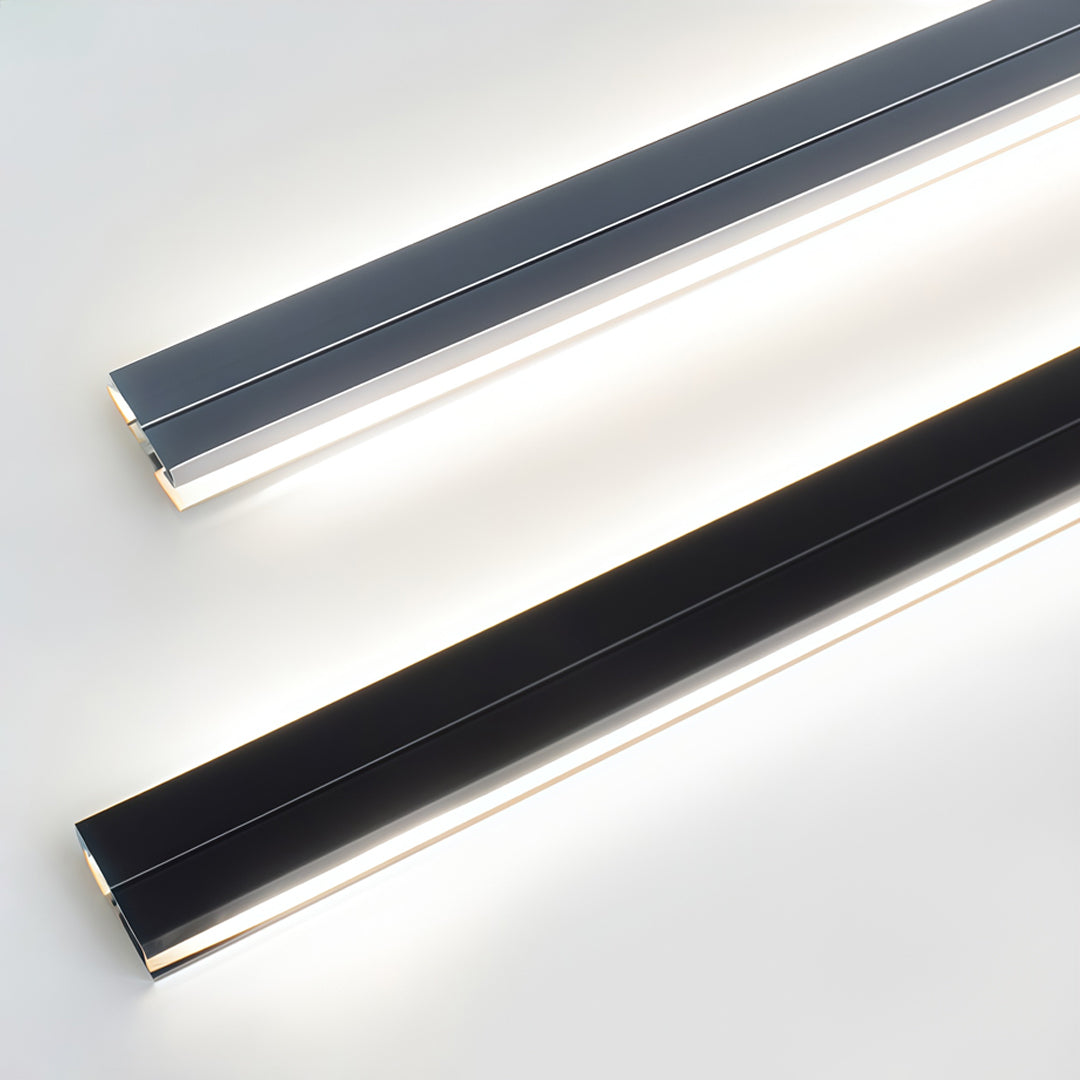 Recessed LED strip lighting close-up showing slim linear illumination integrated into a modern aluminum channel.