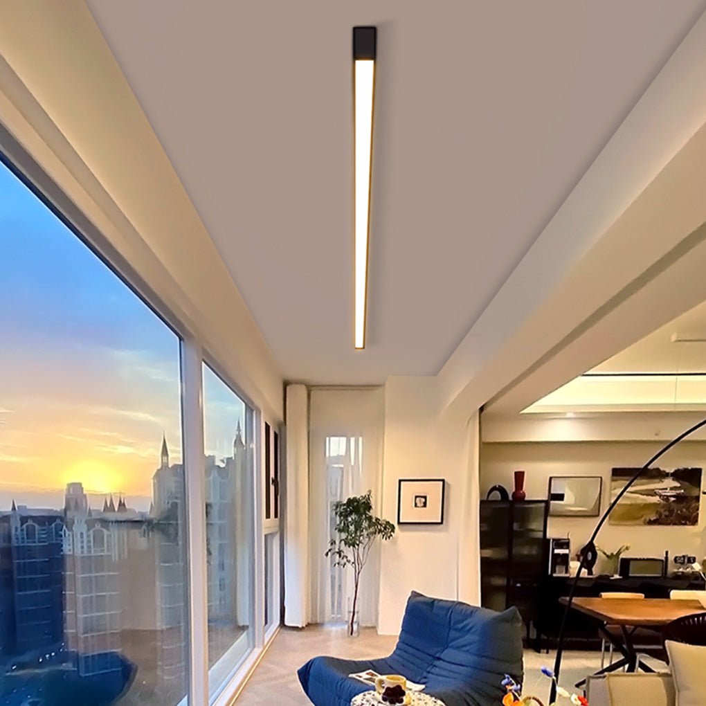 Recessed linear ceiling light used in modern living room lighting design.