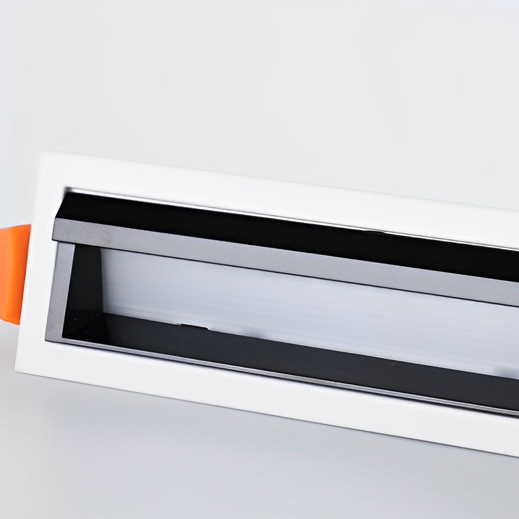 Close-up view of trimless recessed linear light fixture housing