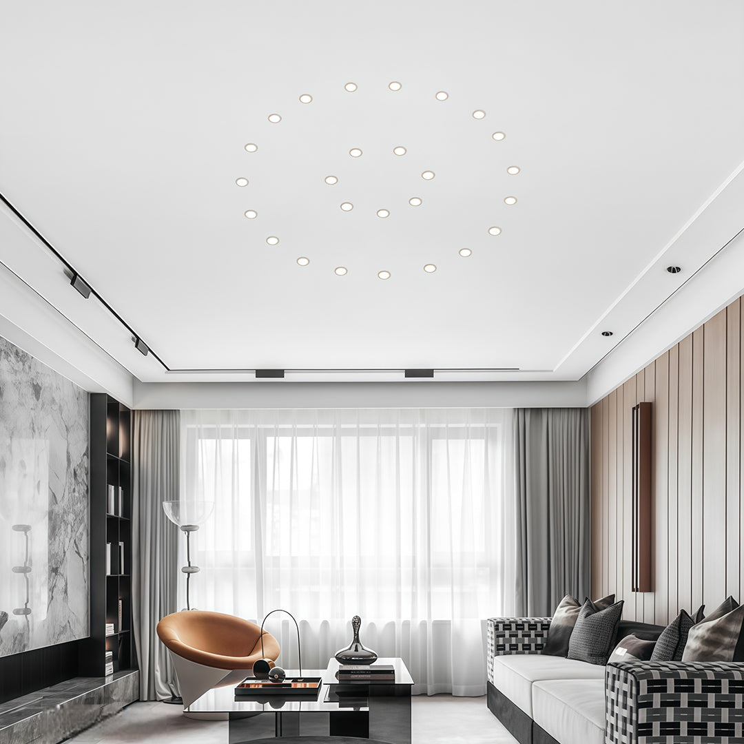 Multiple recessed ceiling spotlights creating layered ambient lighting in elegant living room interior