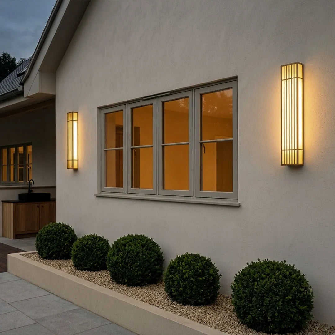 Rectangle LED outdoor wall lights installed along a modern exterior wall beneath a row of windows.