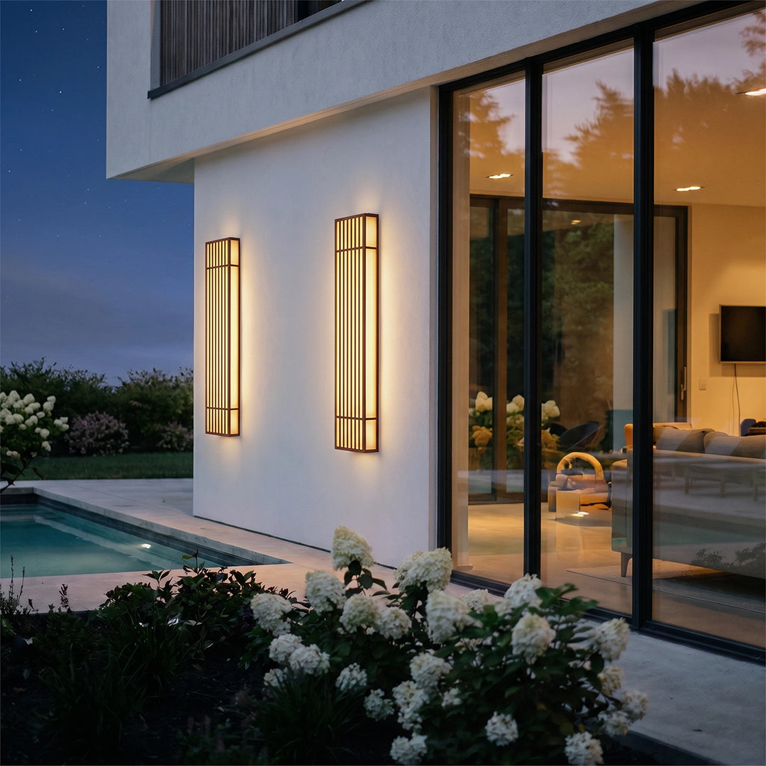 Rectangle LED outdoor wall lights mounted on a white exterior wall beside tall glass doors.