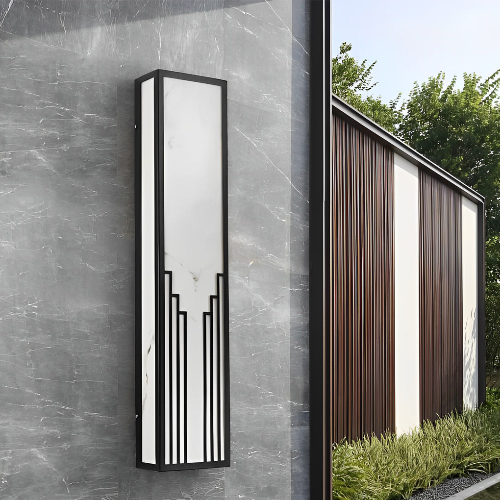 Rectangular exterior wall sconce with a black finish, providing ambient light near a doorway.