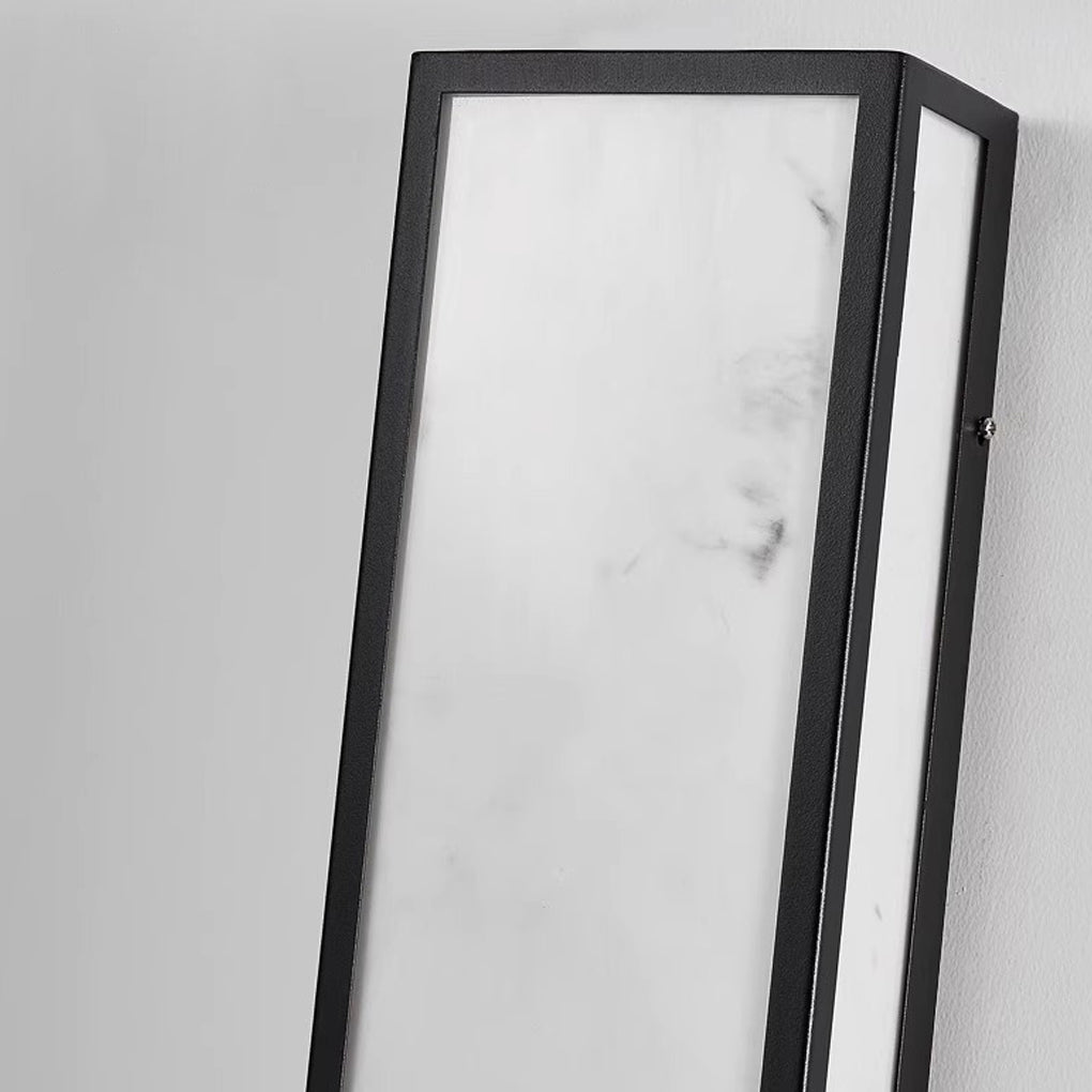 Rectangular exterior wall sconce with a close-up of its illuminated vertical lines.
