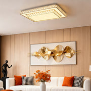 Crystal flush mount ceiling LED light above dining area with modern décor.