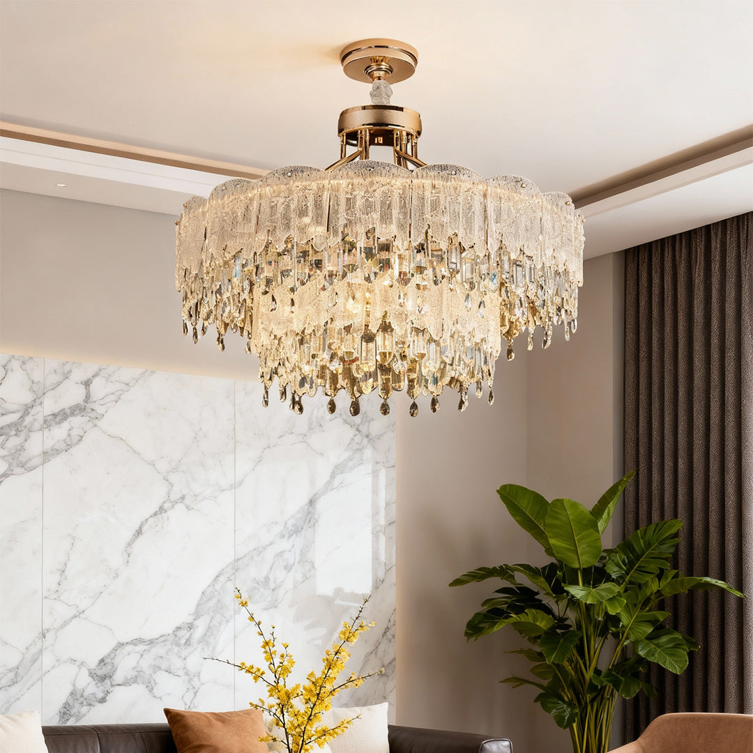 Rectangular gold glass fringe chandeliers above long dining table.