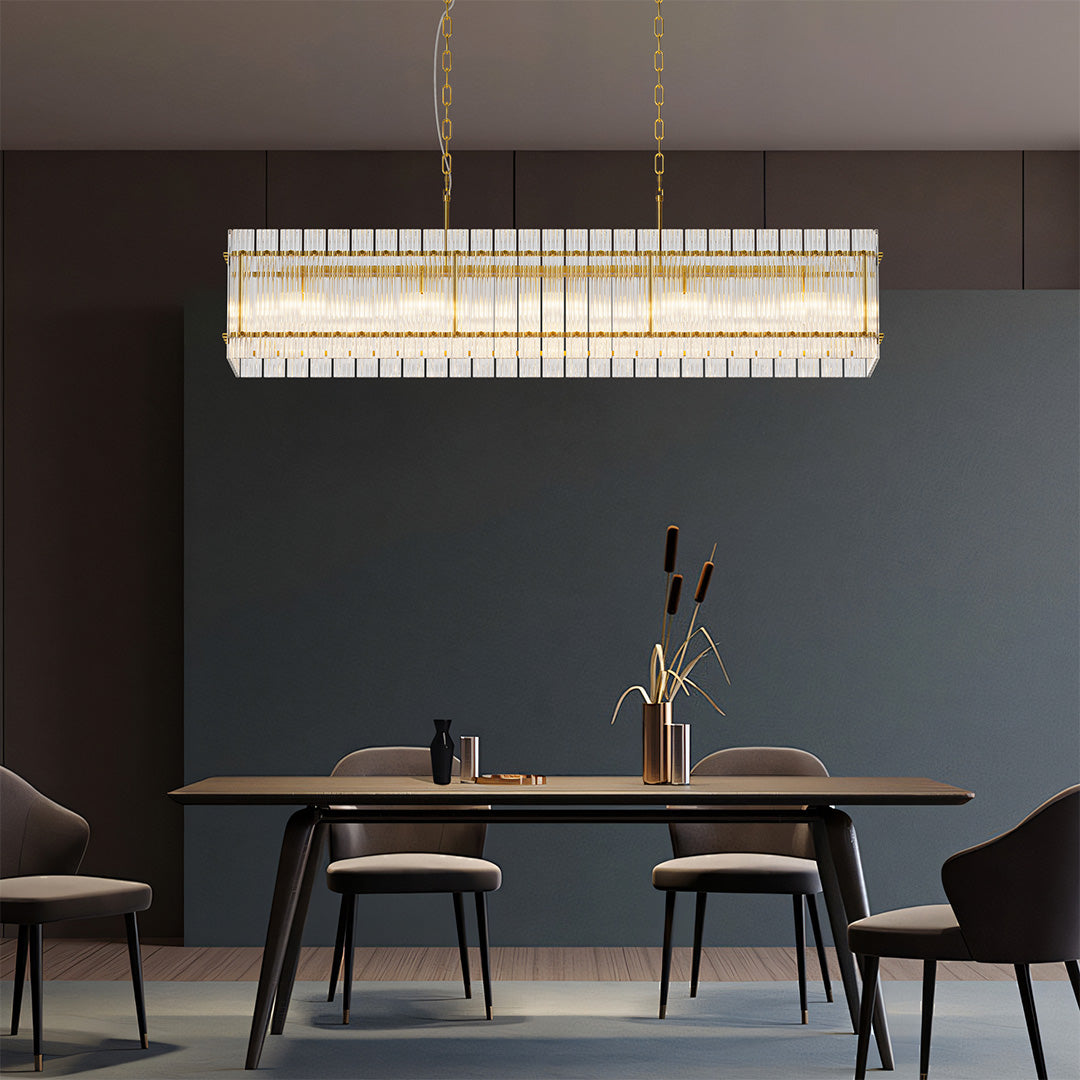 Rectangular gold glass lamp shade chandelier illuminating a contemporary dining room with sleek furniture.