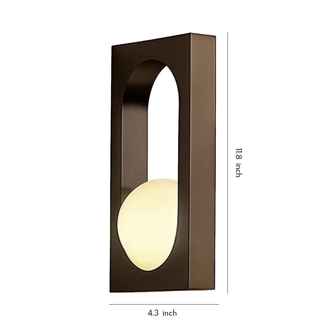 Rectangular wall-mounted sconce emitting warm light, a clean and minimal take on led outdoor wall lighting ideas.