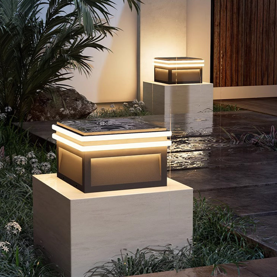 Compact rectangular metal pillar lights featuring clean geometric design with integrated warm white LED lighting