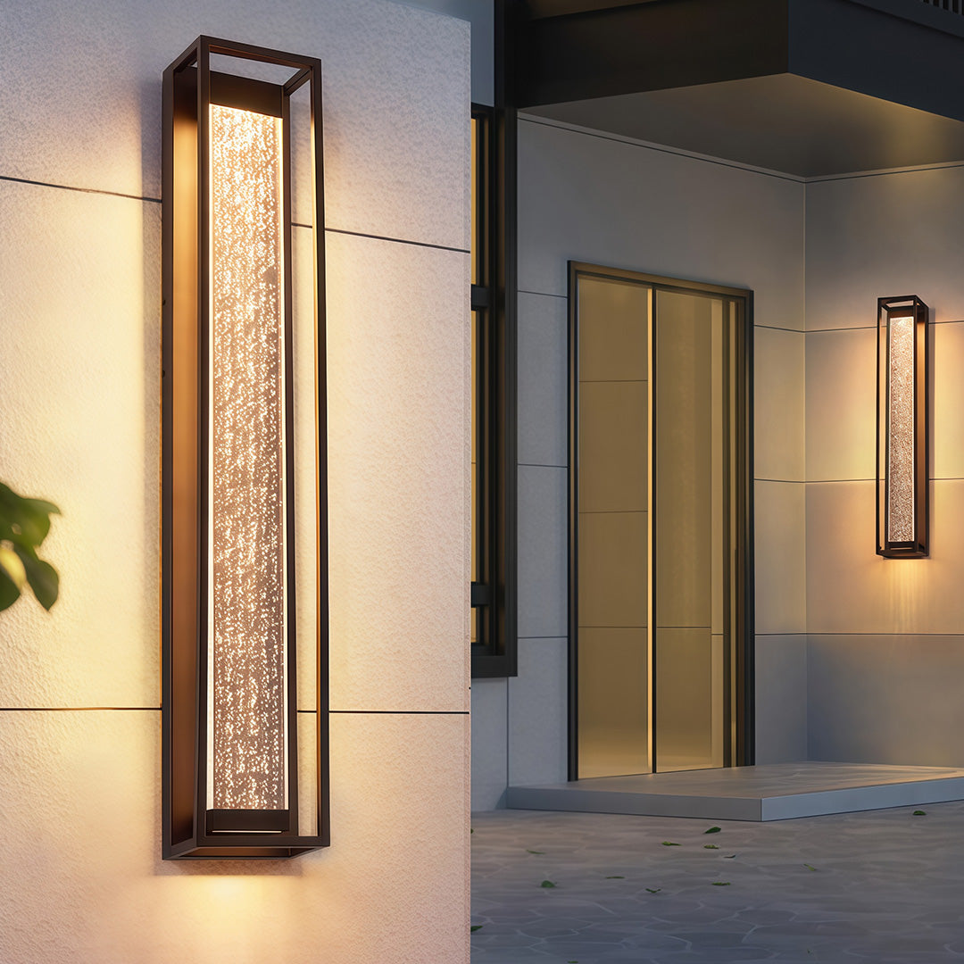 Black outdoor sconces with a rectangular design, providing sophisticated lighting for outdoor spaces.