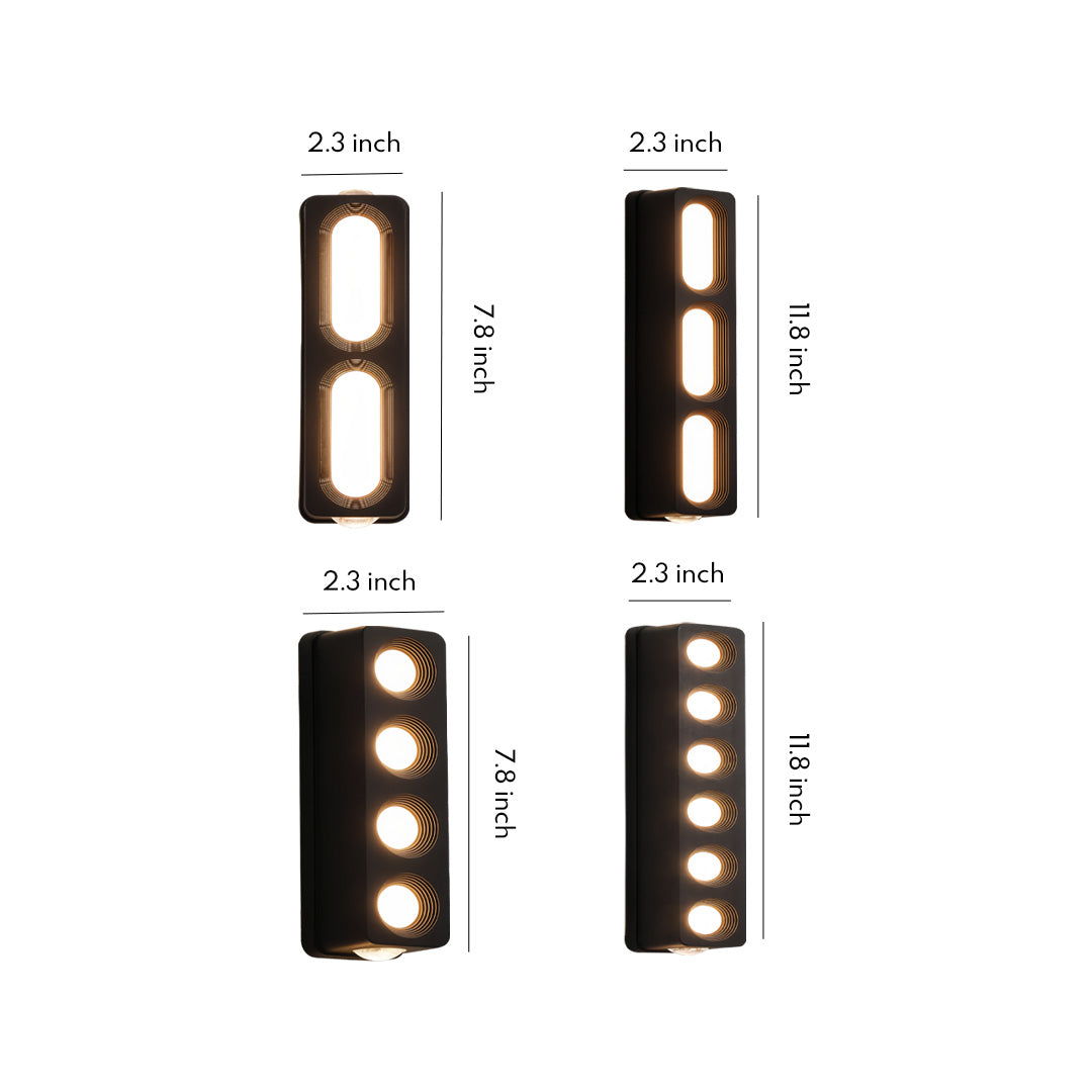 Sleek rectangular unique outdoor wall lighting fixture with multiple cut-out openings, shown on a plain white background.