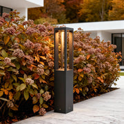 LED bollard garden light with rectangular design, mounted beside stone steps for contemporary garden illumination