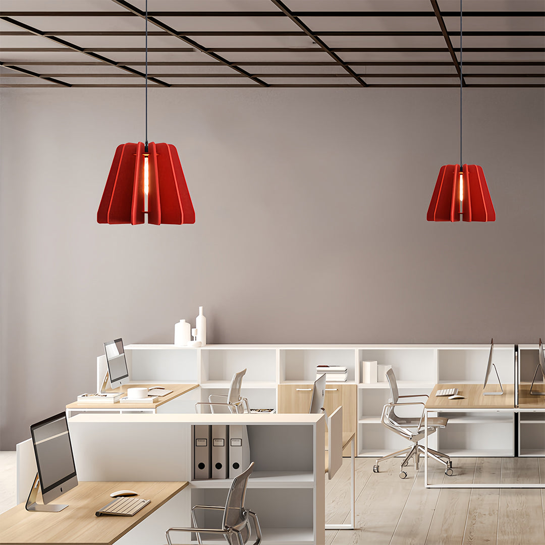 Two striking red 1 light single pendant fixtures illuminating a bright, contemporary open-plan office space.