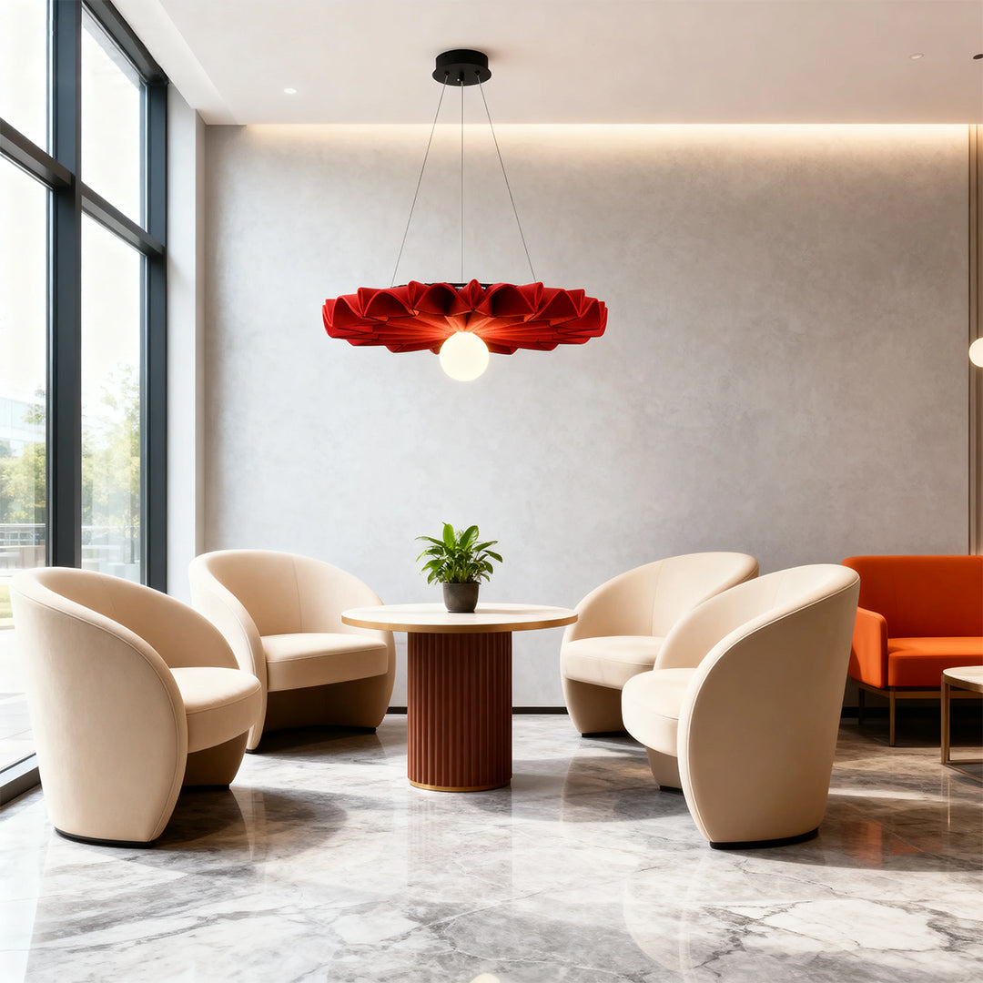 Statement red floral cloth chandelier suspended over seating area in a modern office lobby 