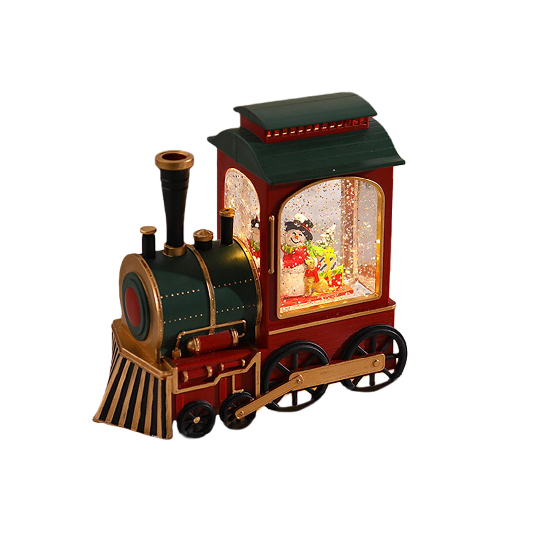 Red and green Christmas train lantern featuring warm glowing Santa display.