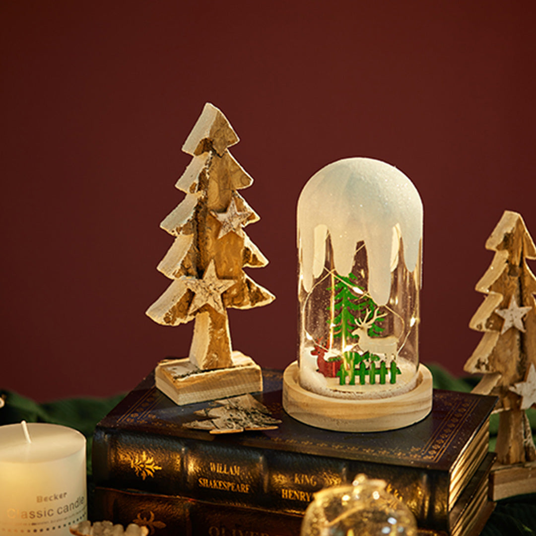 Warm-lit dome lamp with red truck and tree scene, glowing like a festive white glass table lamp.
