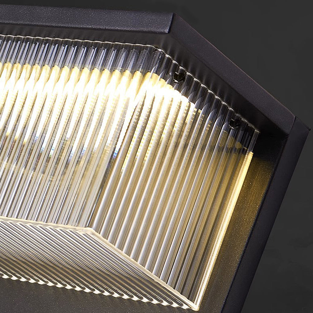 Reeded acrylic sconce with detailed view of its layered acrylic structure.