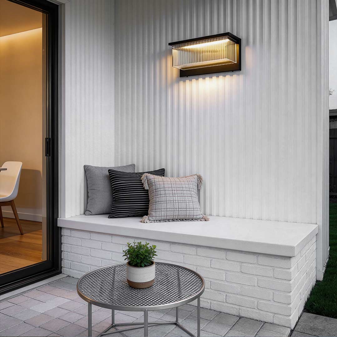 Reeded acrylic sconce enhancing a modern living room with warm light.
