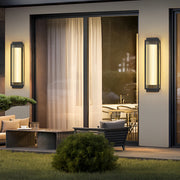 Reeded glass light fixture illuminating a cozy patio area, creating a warm and inviting ambiance.