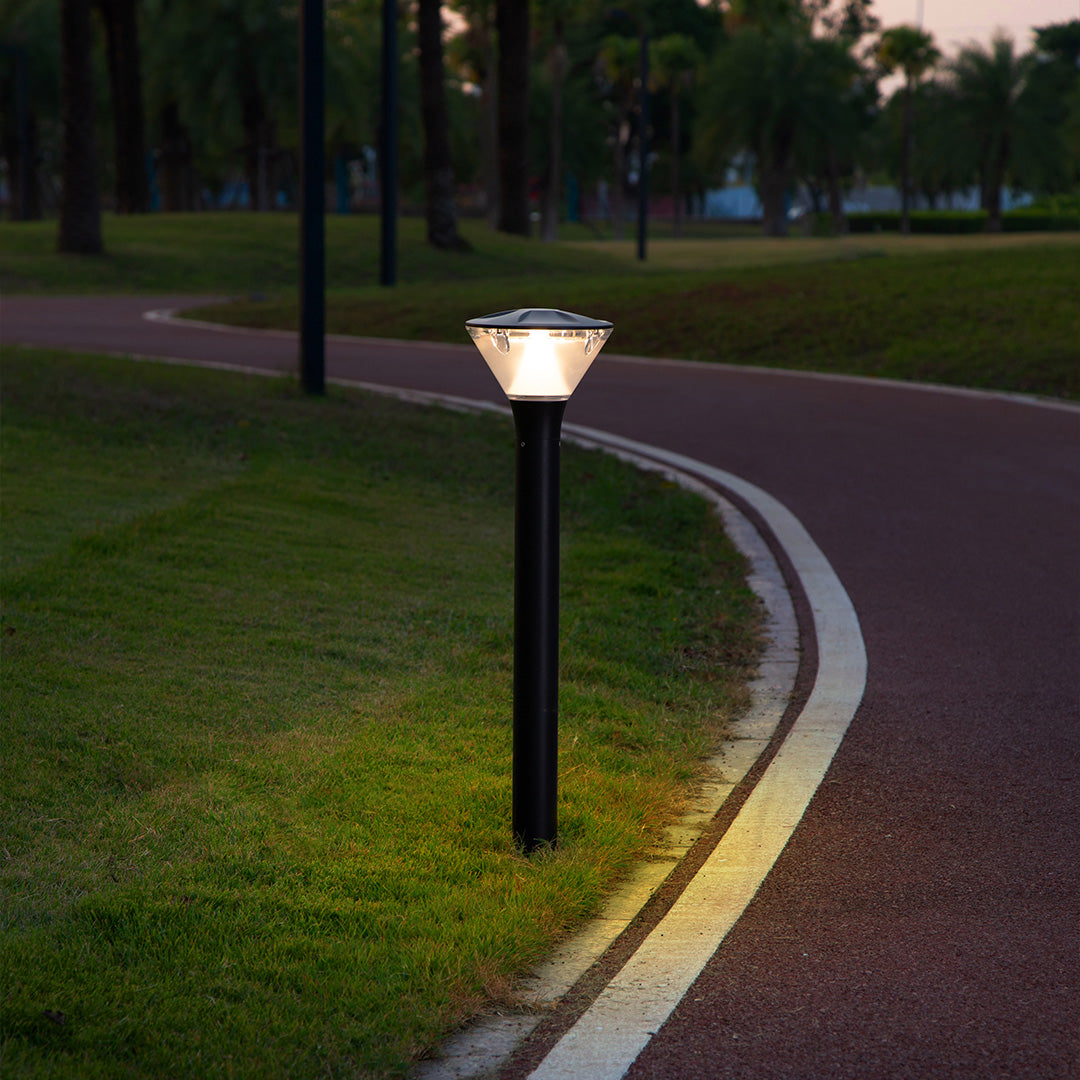 Modern bollard light with transparent conical shade for pathway guidance lighting