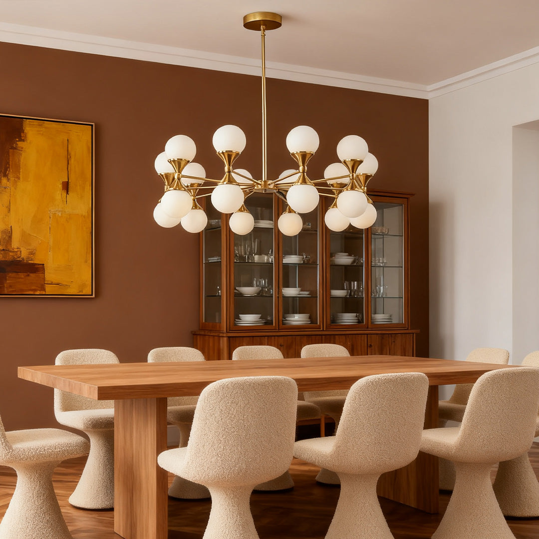 Bubble glass chandeliers lighting up a modern white room, emphasizing the reflective quality of the many small glass spheres.