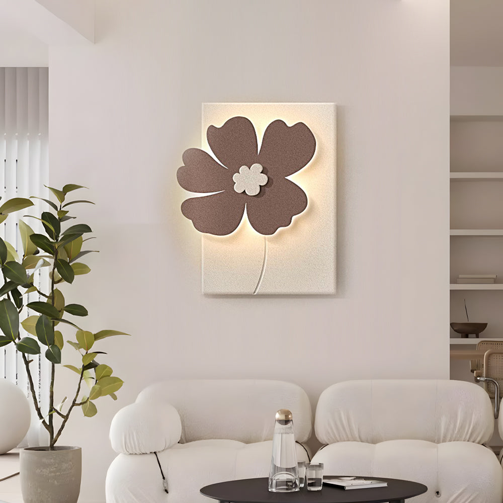 Relief wall lamp with a flower relief, providing warm illumination in a stylish room.