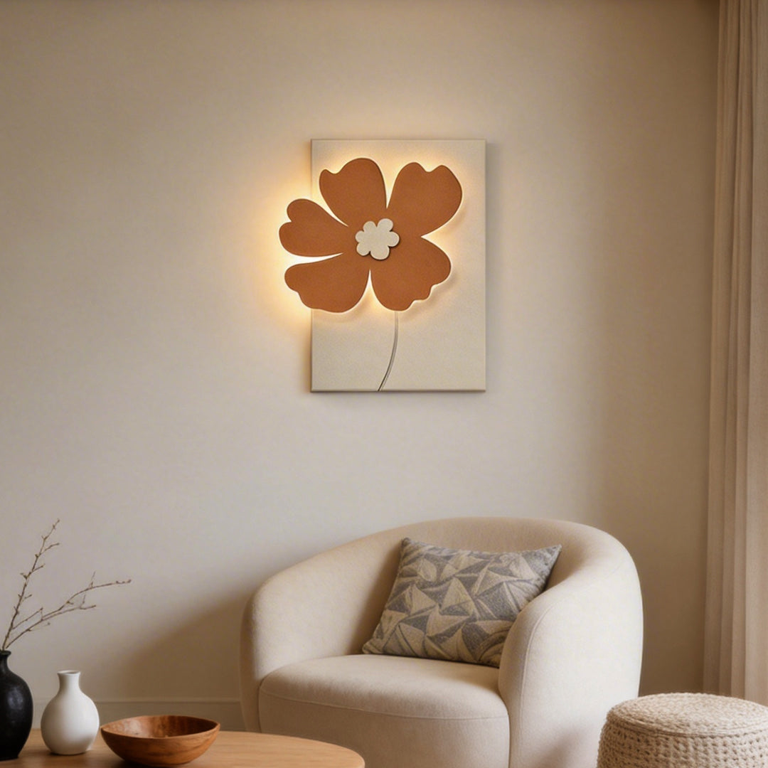 Relief wall lamp with a flower-shaped design, mounted in a cozy living room corner.
