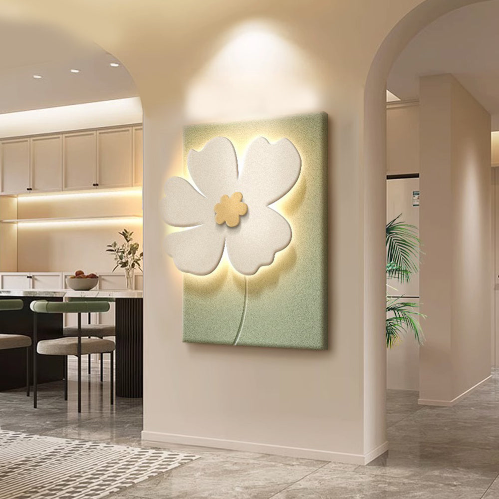 Relief wall lamp with a white and brown flower design, placed above a white sofa.