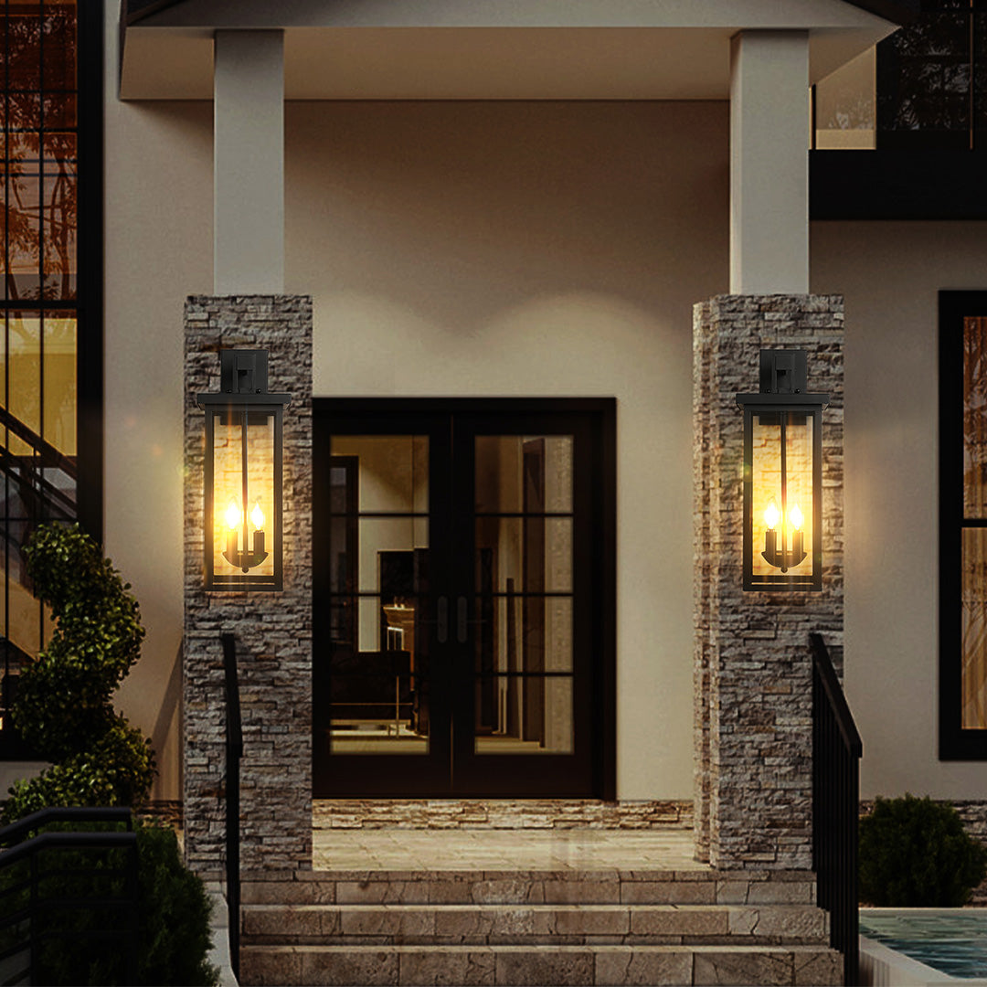 Black external wall light with remote control feature, mounted on a stone pillar for convenient outdoor lighting.
