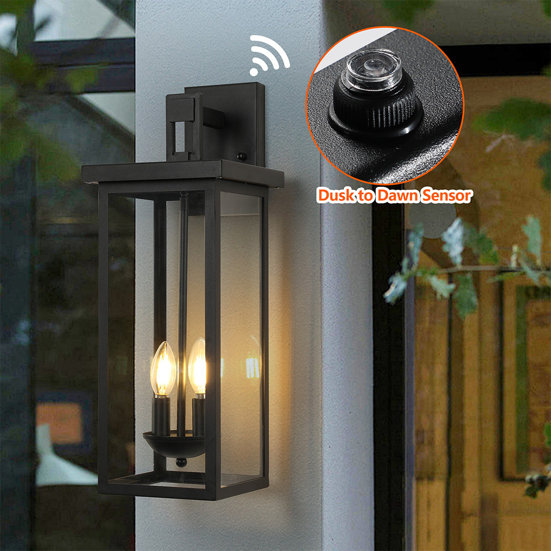 Black external wall light with remote control, installed beside a wooden door for easy access and operation.