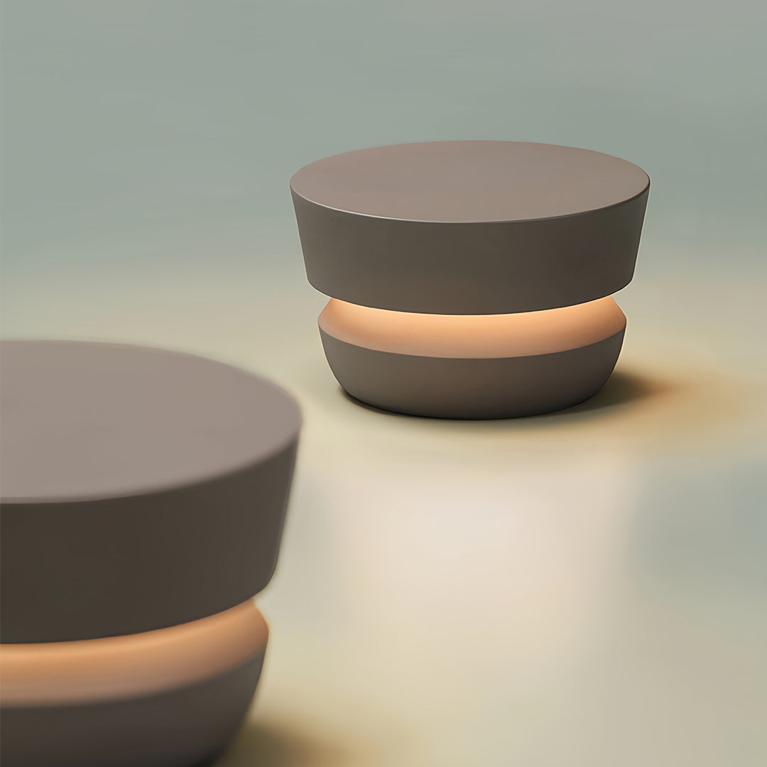 Rendered image of the black pathway lights, showing the soft, warm light emanating from the central band of the fixture.