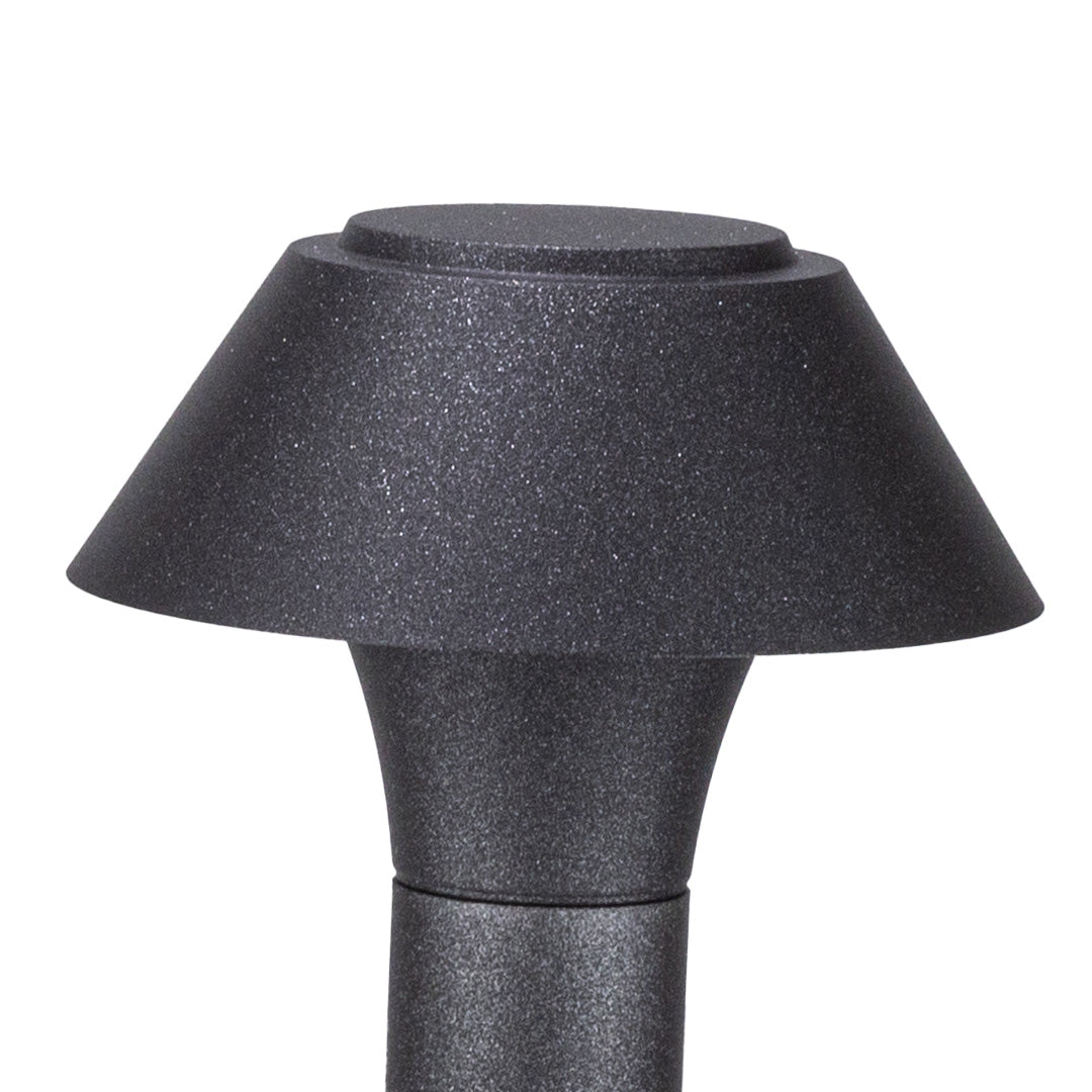 Close up view of residential bollard lights showing textured metal shade and downward light distribution design.