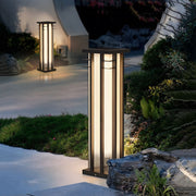Residential entrance area featuring coordinated bollard lighting providing welcoming illumination along walkway