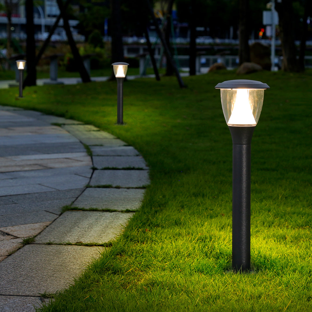 Acorn-style post light creating warm ambient lighting in residential garden area