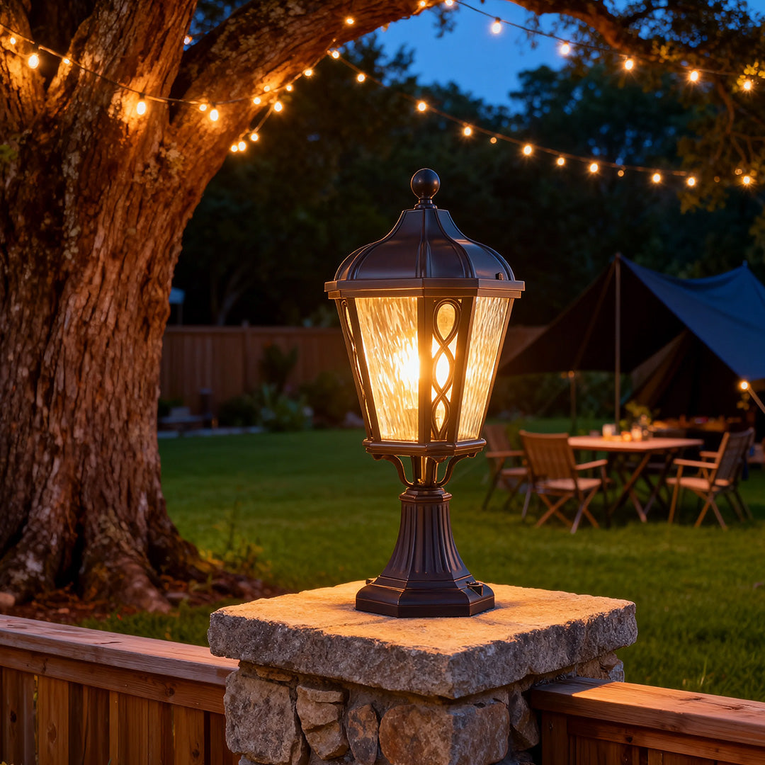 Black post light in a residential garden, elegant and functional outdoor lighting