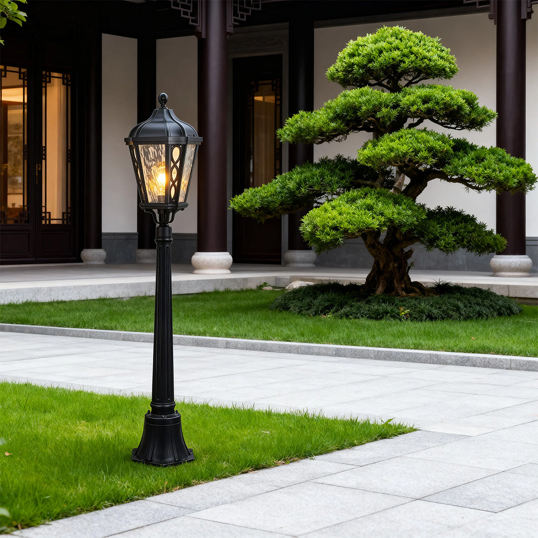 Bollard light in a residential garden, warm and inviting outdoor lighting fixture