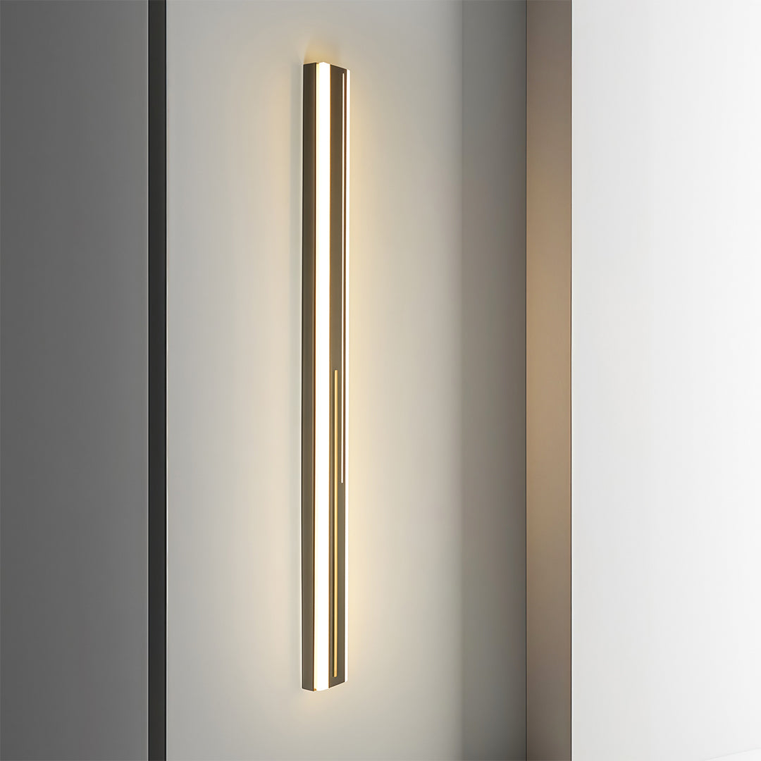 Residential outdoor wall mount lighting on minimalist exterior wall with vertical illumination design