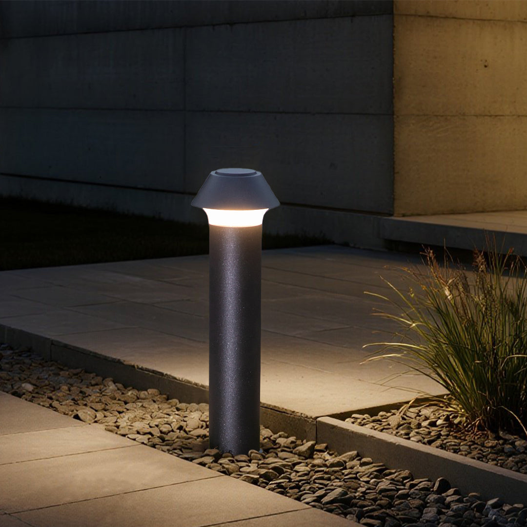 Evening residential setting with pagoda-style bollard lights creating warm ambient illumination