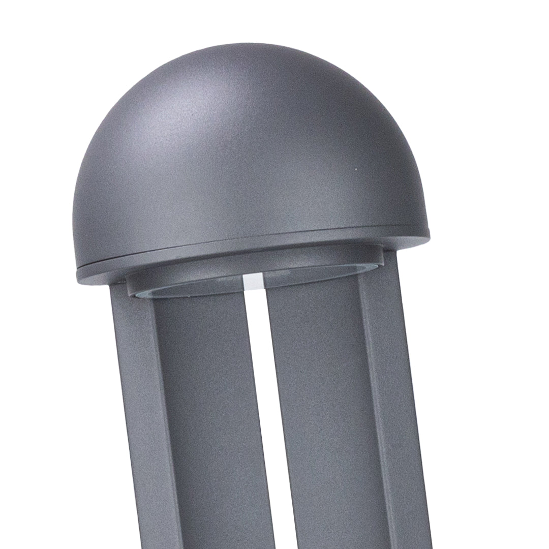 Architectural lighting creating ambient illumination along residential paved pathway at dusk