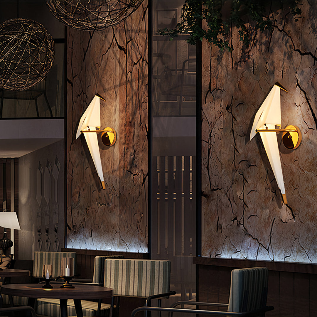 Decorative bird wall light featuring crane design in modern restaurant dining environment