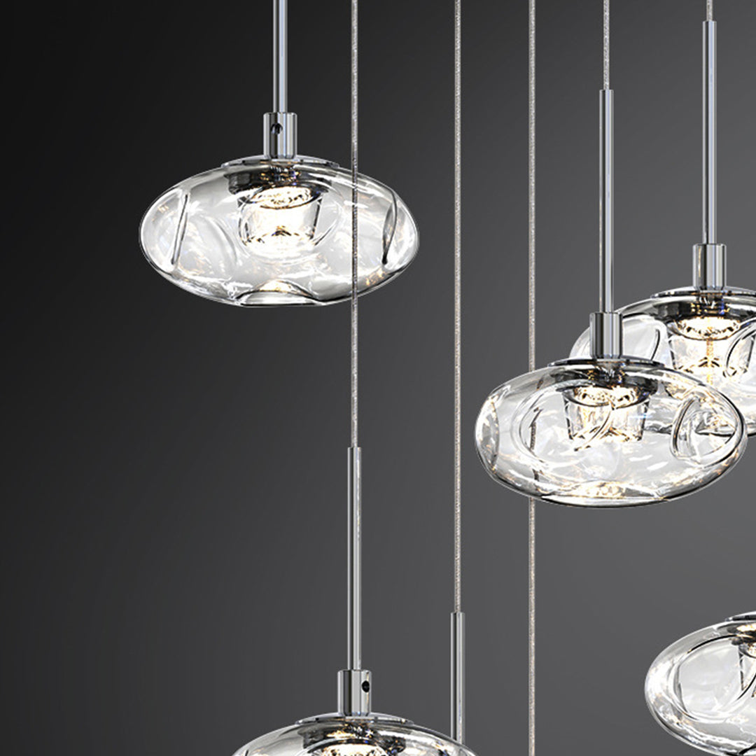 Elegant multi light pendant lighting enhancing modern restaurant interior with multiple crystal glass shades