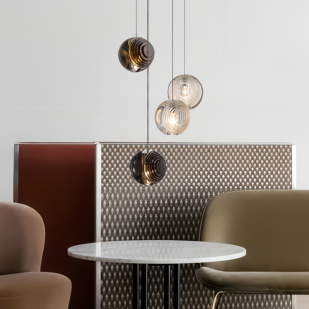 Restaurant setting featuring small black pendant lights over seating area creating intimate atmosphere