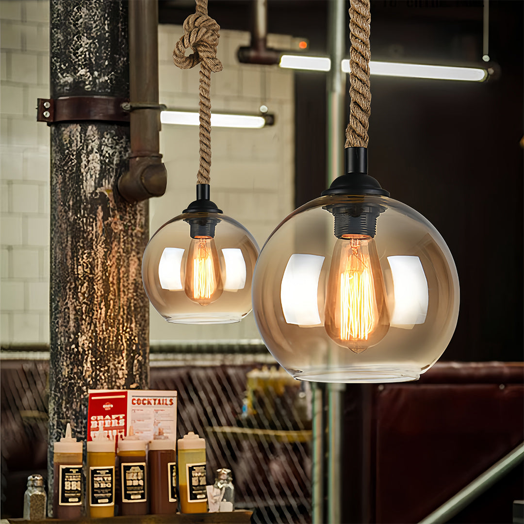 Retro glass pendant lights illuminating rustic bookstore interior with warm ambient glow.