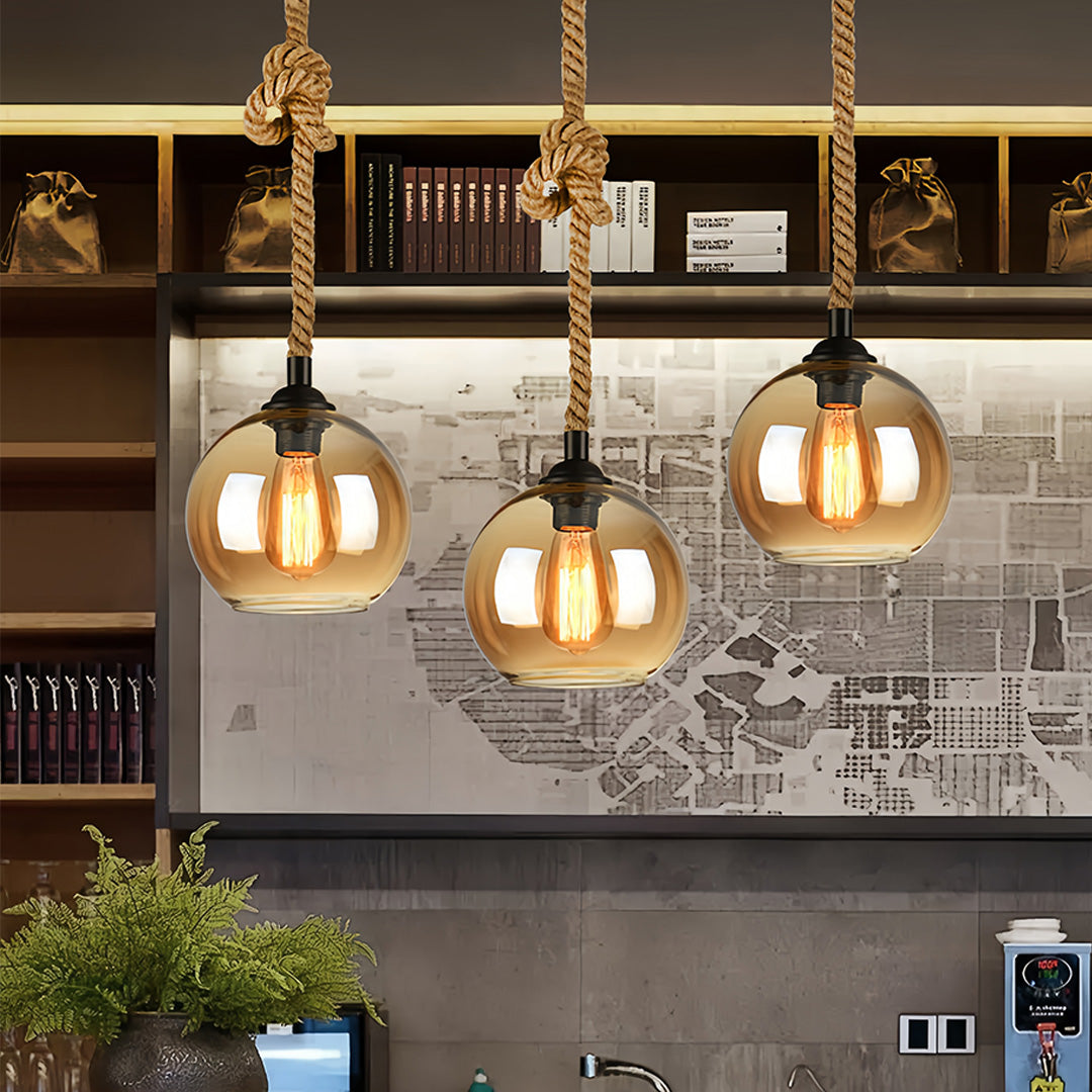 Cluster of retro glass pendant lights providing stylish illumination in contemporary kitchen area.
