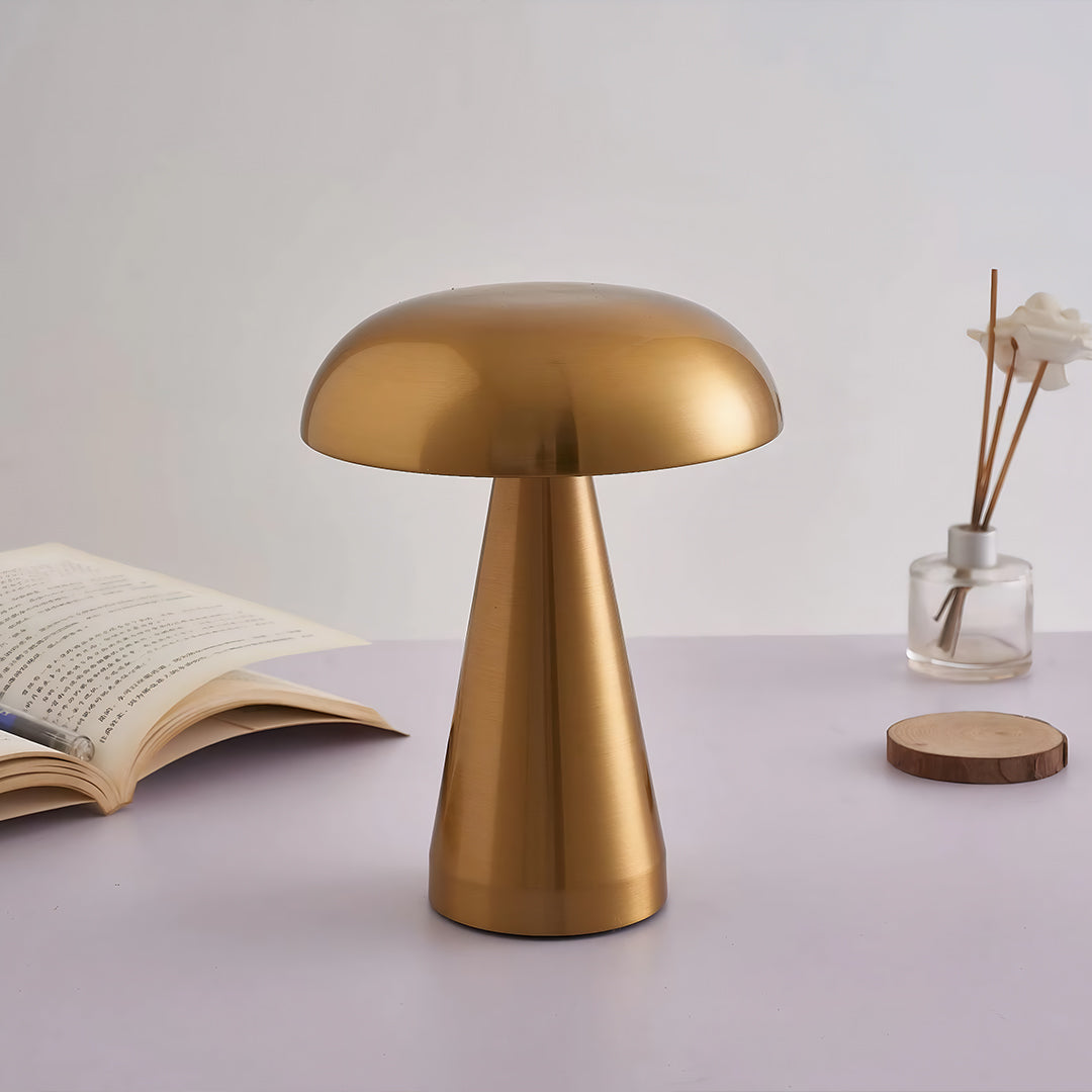 Retro metal table lamp with bronze finish displayed on neutral surface with dried flowers