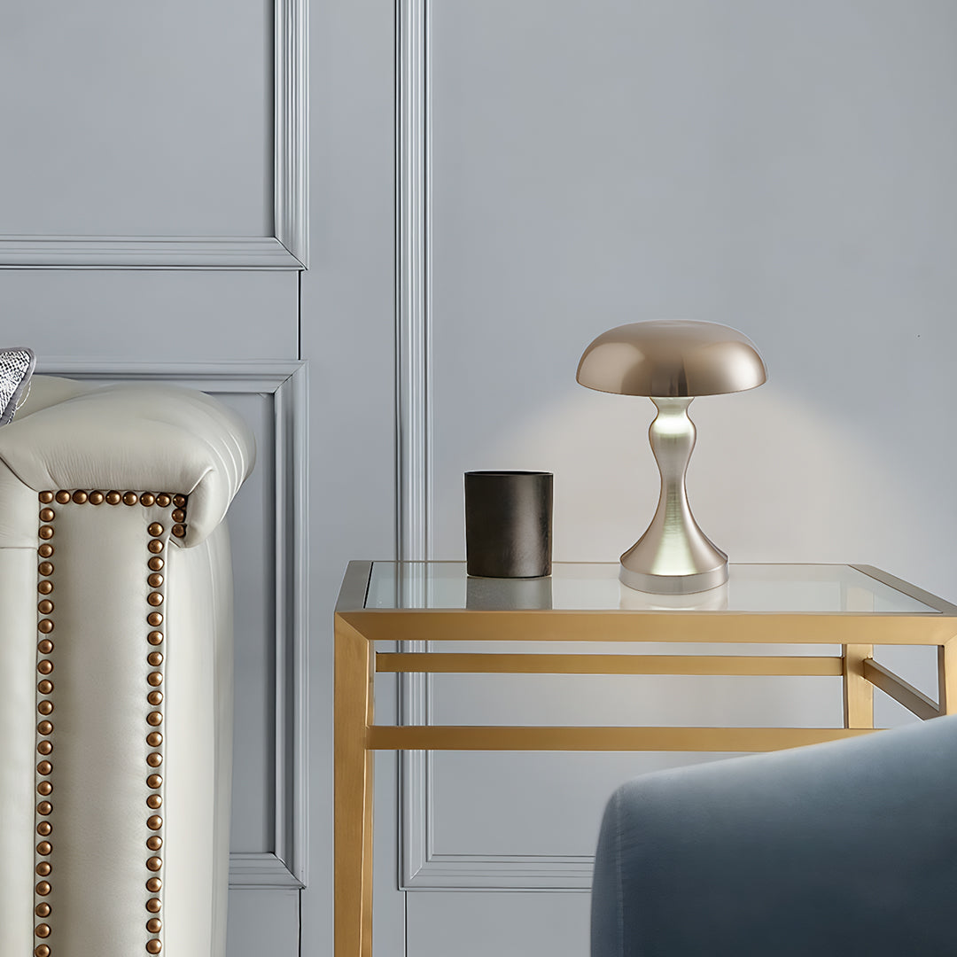 Retro metal table lamp positioned on glass side table in contemporary bedroom setting