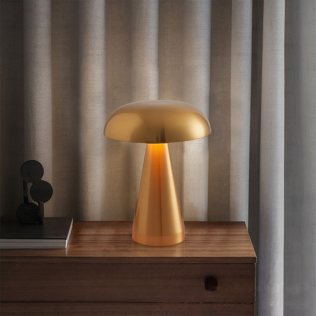 Retro metal table lamp illuminating wooden console with warm ambient lighting at dusk